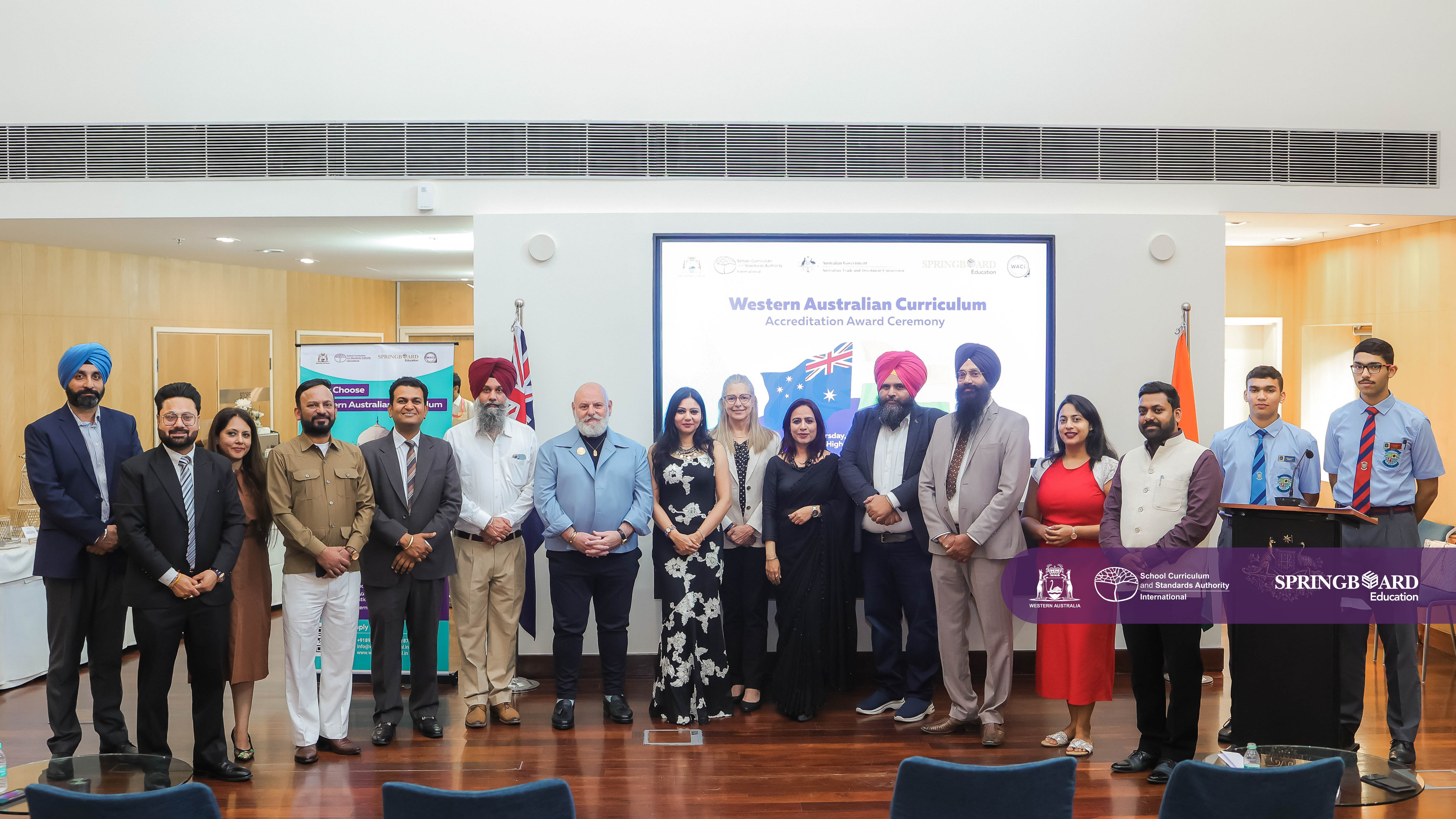 A group of students and teachers at the accreditation ceremony